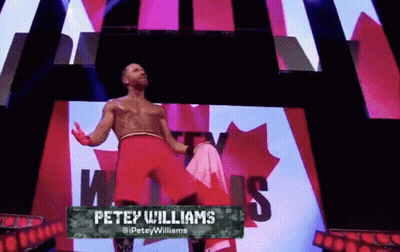 Man Standing In Front Of WWE Sign GIF