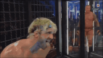 Man Standing In Front Of WWE Sign GIF