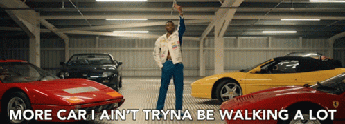 Man Standing In Garage With Cars GIF