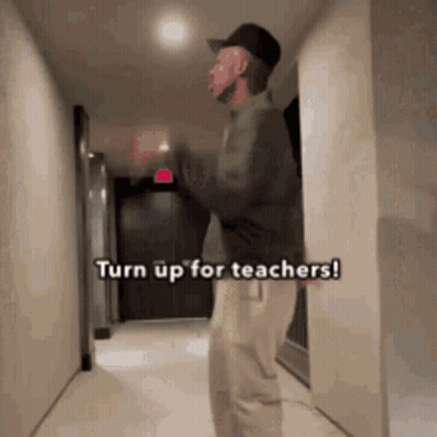 Man Standing In Hallway Turn Up For Teachers GIF