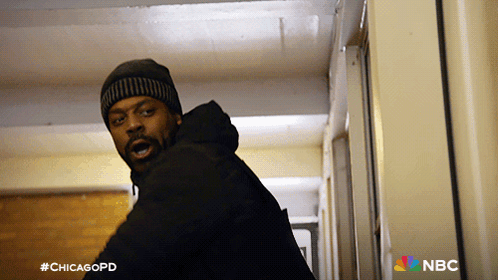 Man Standing In Hallway With #Chicagopd GIF