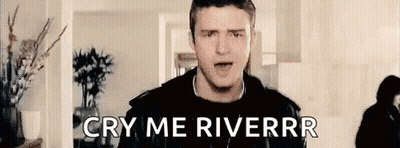 Man Standing In Living Room Saying Cry Me Riverrr GIF