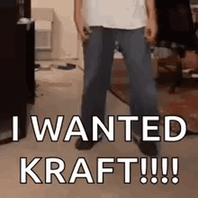 Man Standing In Living Room With Sign I Wanted Kraft GIF