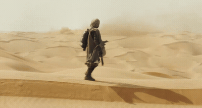 Man Standing In Sandy Desert GIF