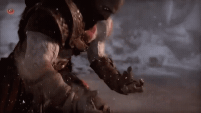 Man Standing In Snow Holding Sword GIF