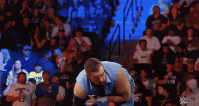Man Standing In Wrestling Ring Facing Crowd GIF