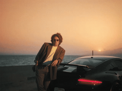 Man Standing Next To Black Sports Car California License Plate GIF