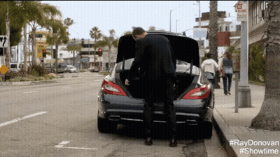 Man Standing Next To Car With Trunk Open #RayDonovan #Showtime GIF