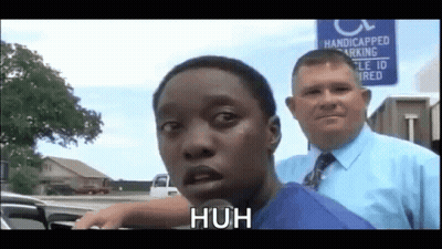 Man Standing Next To Handicapped Parking Sign GIF