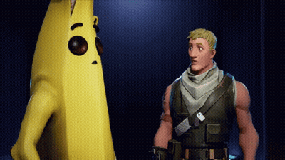 Man Standing Next To Large Yellow Banana GIF