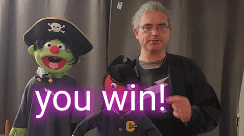 Man Standing Next To Pirate Puppet Saying You Win GIF