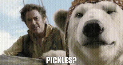 Man Standing Next to Polar Bear Asking for Pickles