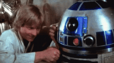 Man Standing Next To R2D2 Robot GIF