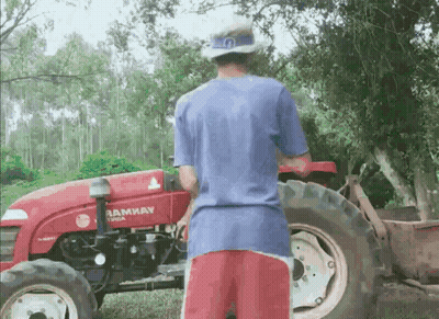 Man Standing Next To Red Tractor Saying Ramway GIF