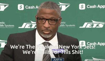 Man Standing Next To Seahawks Logo GIF