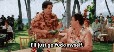 Man Standing Next To Woman At Table In Park GIF