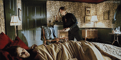 Man Standing Next To Woman Laying On Bed Rocktheholygrail GIF