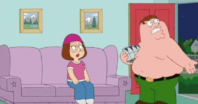 Man Standing Next To Woman Sitting On Couch GIF