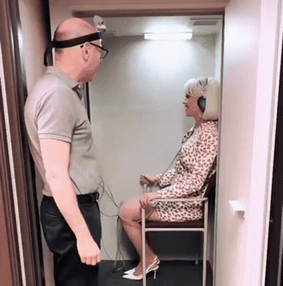 Man Standing Next To Woman With Headphones GIF