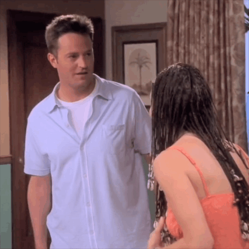 Man Standing Next To Woman With Wet Hair GIF