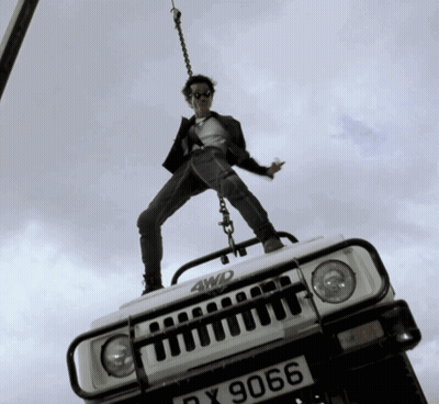 Man Standing On 4WD Vehicle GIF