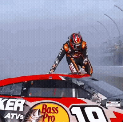 Man Standing On Bass Pro Race Car GIF