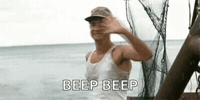 Man Standing On Boat Waving In Ocean GIF