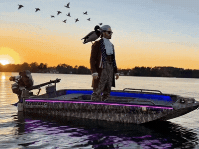 Man Standing On Boat With Duck Saying Havoc GIF