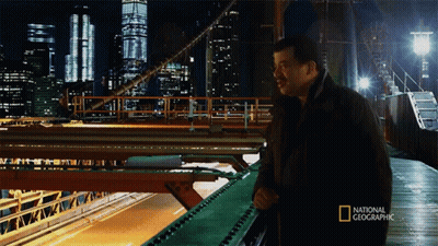 Man Standing On Bridge With National Geographic GIF