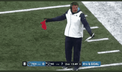Man Standing On Football Field With Red Flag GIF