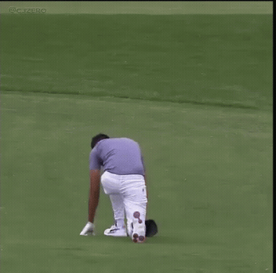 Man Standing On Golf Course With Arms Up GIF