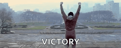 Man Standing On Ledge With Victory GIF