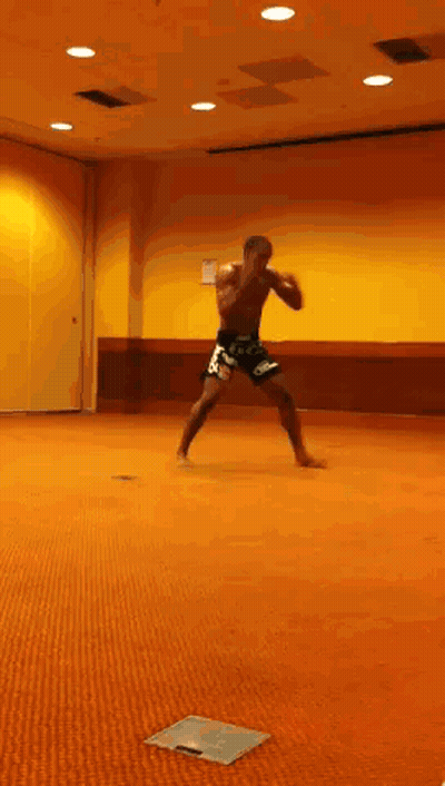 Man Standing On Orange Carpet In Room GIF