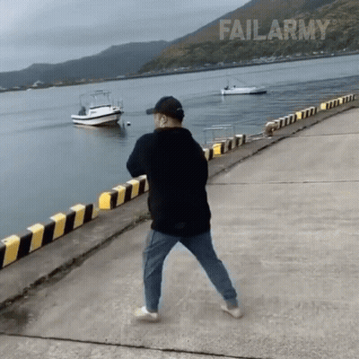 Man Standing On Pier Near Water GIF