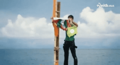 Man Standing On Pole In Ocean Eitb.eus GIF