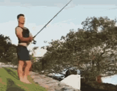 Man Standing On Rock Fishing GIF