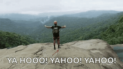 Man Standing On Rock Saying Yahoo GIF