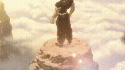 Man Standing On Rock Surrounded By Clouds GIF
