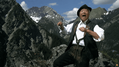 Man Standing On Rocky Mountain GIF