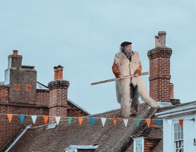 Man Standing On Roof With Stick GIF