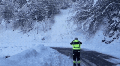 Man Standing On Snowy Road GIF