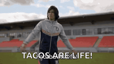 Man Standing On Soccer Field With Arms Outstretched GIF