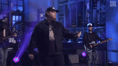 Man Standing On Stage Playing Guitar GIF