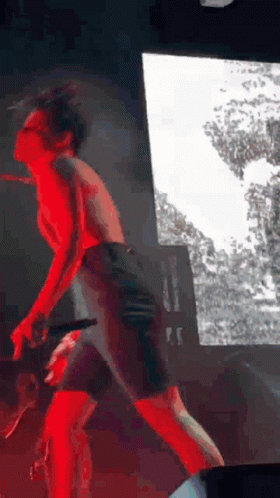 Man Standing On Stage Without Shirt GIF