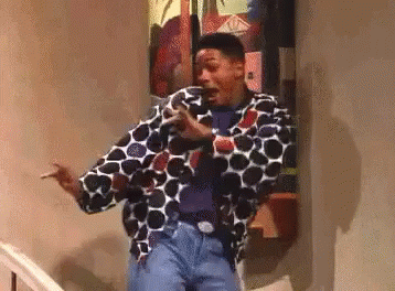 Man Standing On Stairs In Polka Dot Jacket GIF