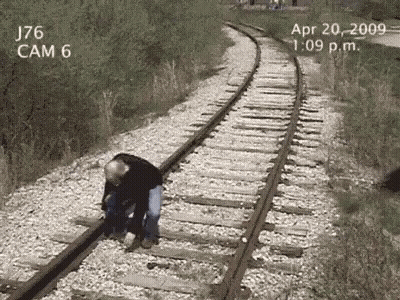 Man Standing On Train Tracks April 20 2009 GIF