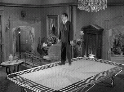 Man Standing on Trampoline Black and White
