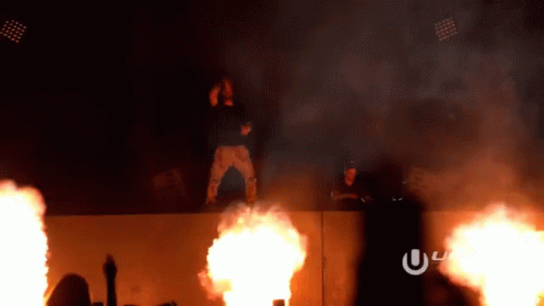 Man Standing On Wall With Fire GIF
