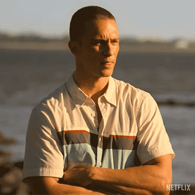 Man Standing With Arms Crossed In Front Of Ocean GIF
