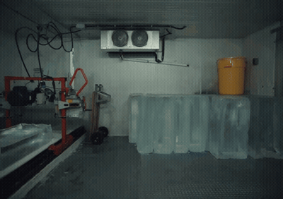 Man Standing With Ice Cubes And Cooler GIF